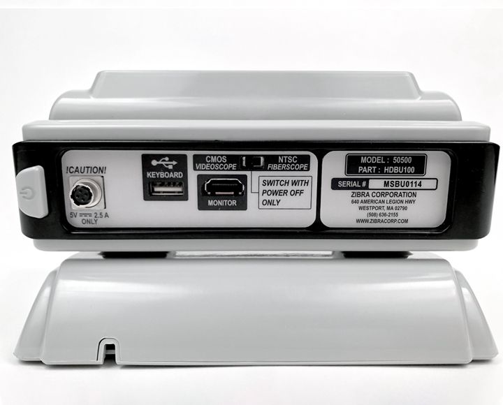 The back of a gray and black device that says ' maintenance only ' on it