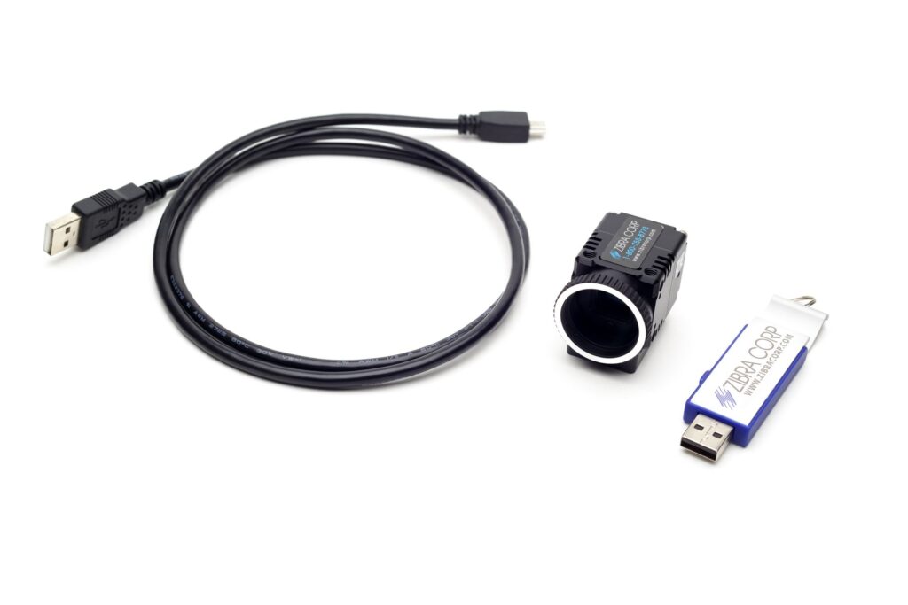 A usb cable a camera and a flash drive on a white background