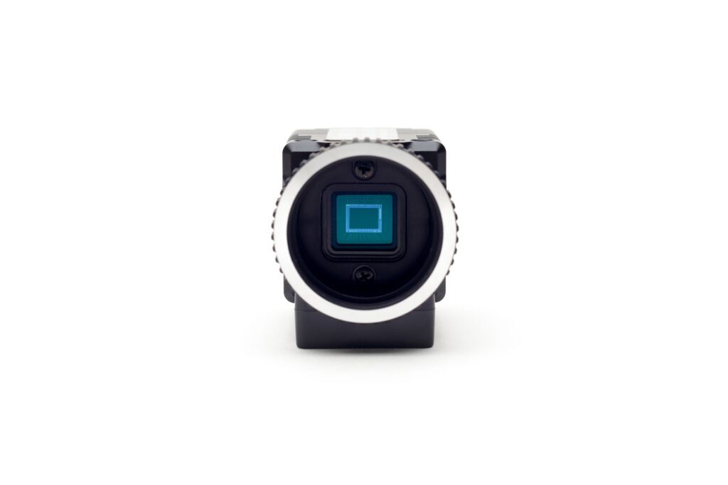 A close up of a camera on a white background.