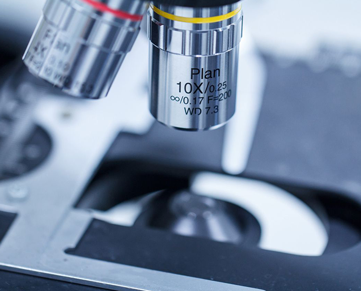 close-up image of magnifying scope with blurry background