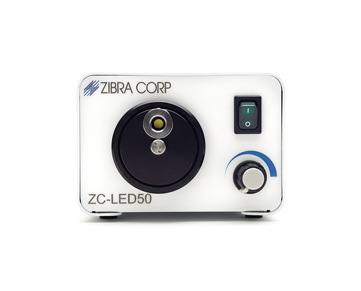 Black object with adjustable knob and the letters "zibra corp" on a white background