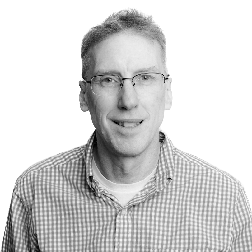 headshot of man in black and white