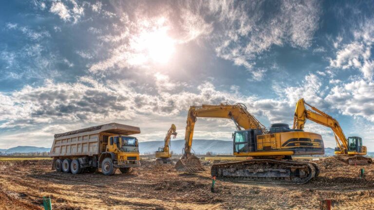 dump trucks and excavators on a construction site