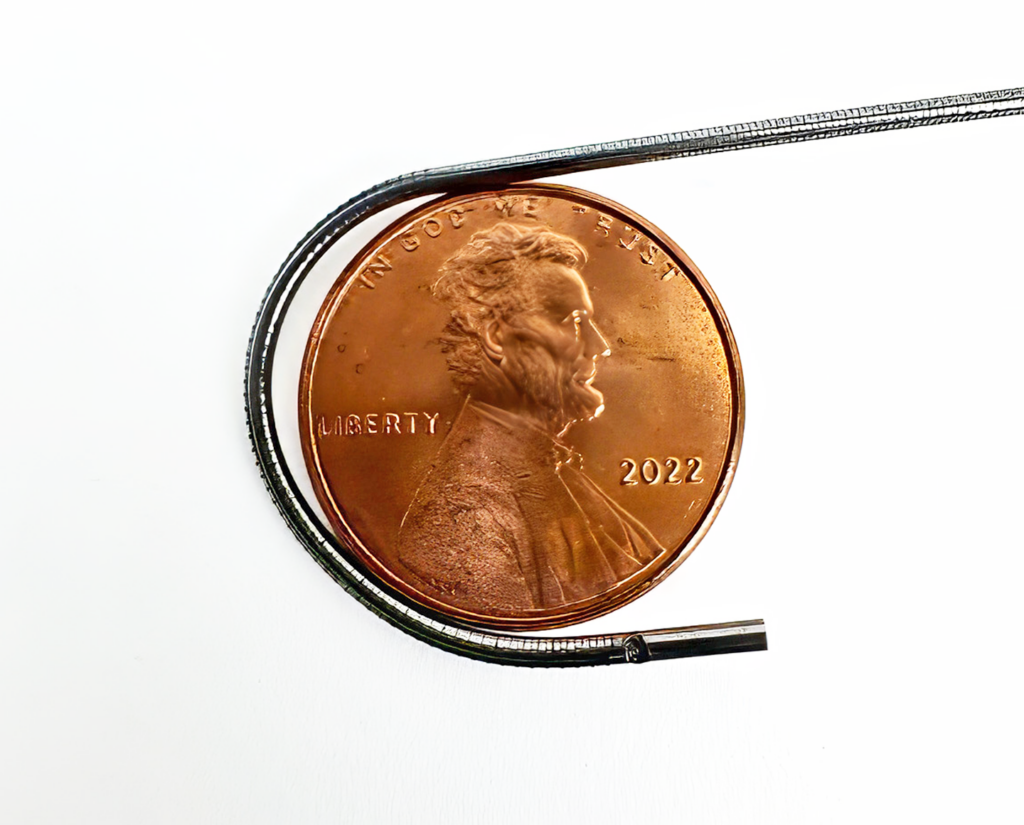 1.1 diameter video borescope wrapped around a penny