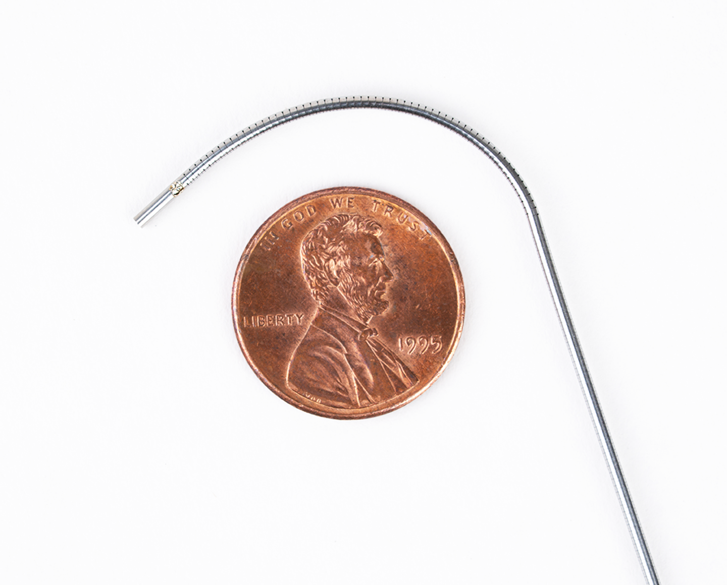 1.1 diameter Milliscope bent over a US penny