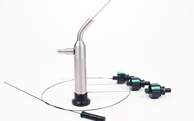 A stainless steel pipe with a hose attached to it